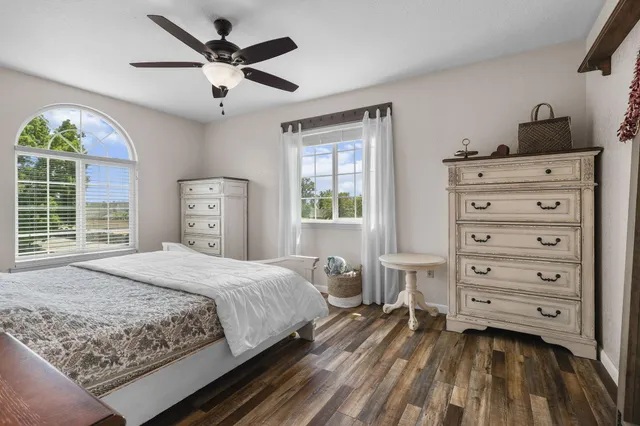 a view of a hallway with entryway wooden floor and front door