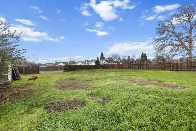 a view of an empty room with windows