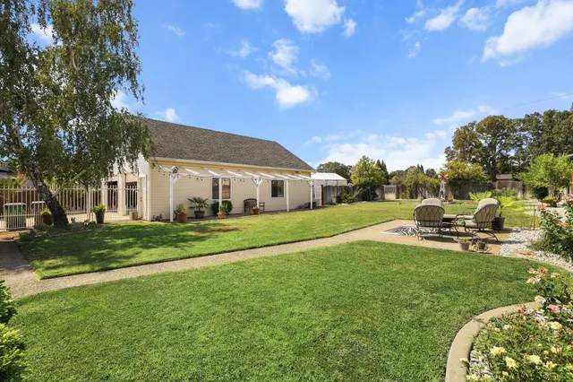 a view of an empty room with window and closet area