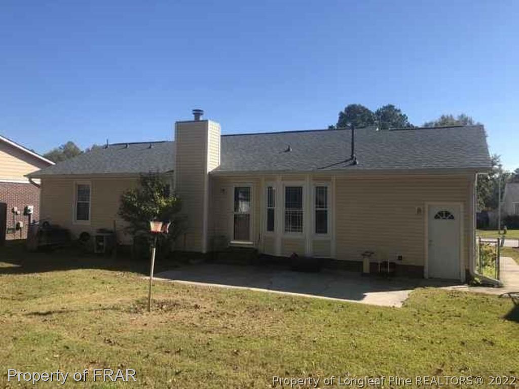 6516 Applewhite Road Fayetteville, NC 28304 - Photo 3 of 12 a view of a house with a yard