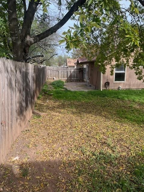 339 Fantail Loop, Unit B Austin, TX 78734 - Photo 13 of 13 a front view of a house with a yard