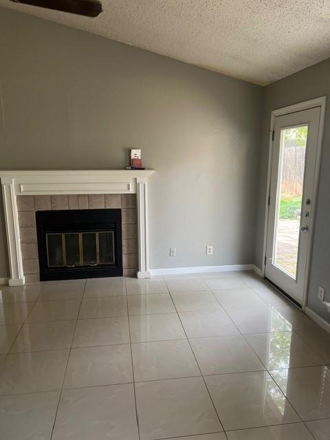 339 Fantail Loop, Unit B Austin, TX 78734 - Photo 2 of 13 a view of an empty room with a fireplace and a window