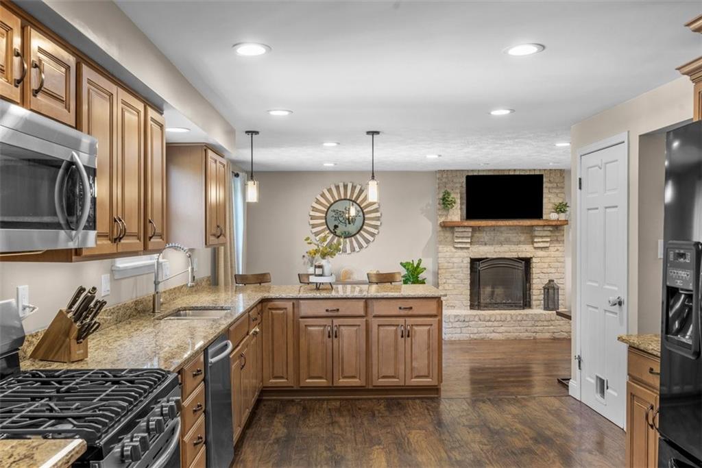229 Lakeside Drive McKees Rocks, PA 15136 - Photo 11 of 35 a kitchen with a sink stove and microwave