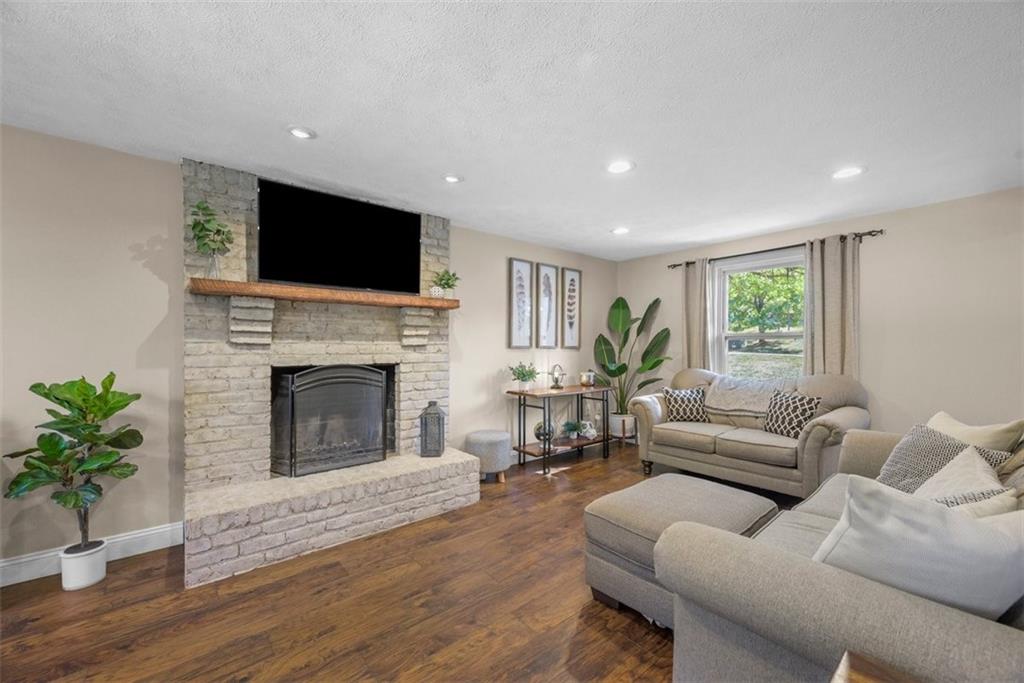 229 Lakeside Drive McKees Rocks, PA 15136 - Photo 15 of 35 a living room with furniture a flat screen tv and a fireplace