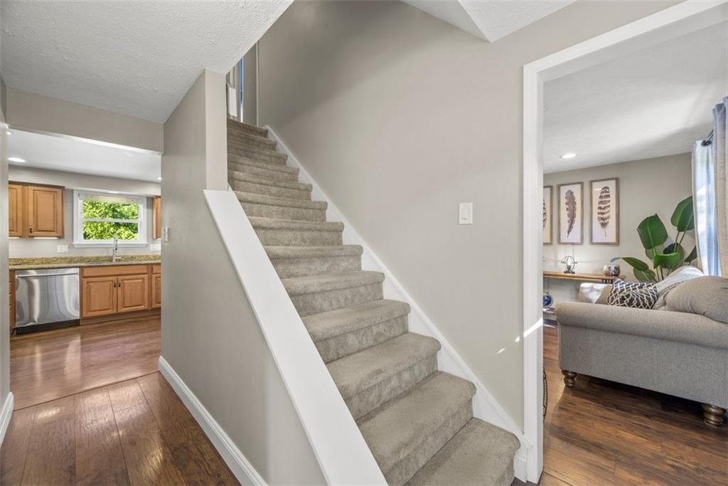 229 Lakeside Drive McKees Rocks, PA 15136 - Photo 16 of 35 a view of a living room with furniture and a fireplace