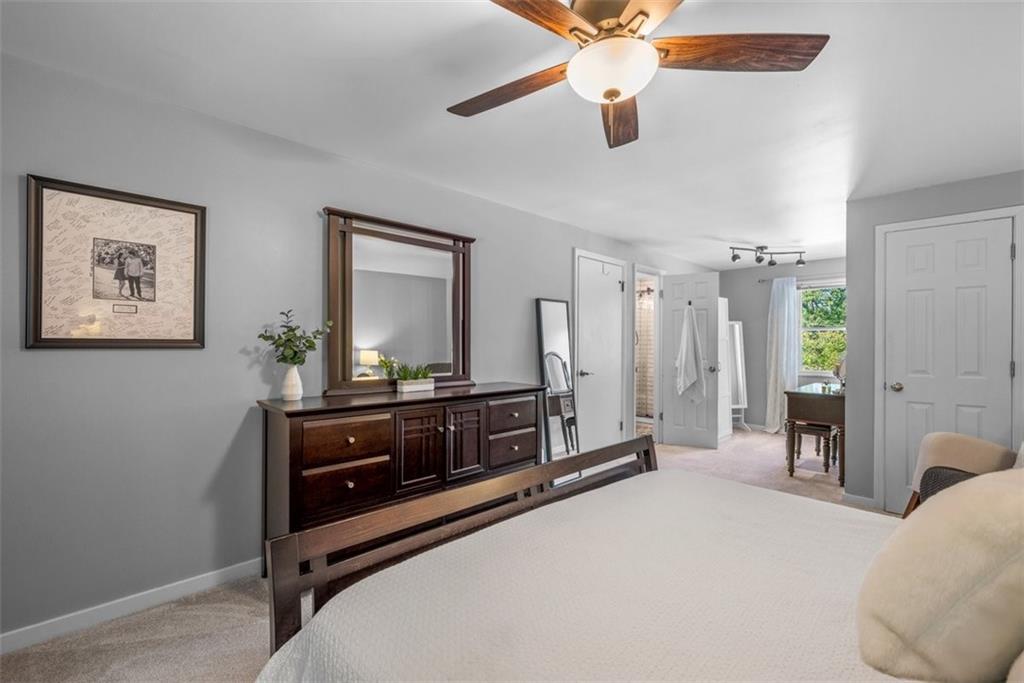 229 Lakeside Drive McKees Rocks, PA 15136 - Photo 20 of 35 a bedroom with a bed and a chandelier