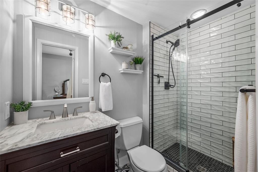 229 Lakeside Drive McKees Rocks, PA 15136 - Photo 21 of 35 a bathroom with a granite countertop sink toilet and shower