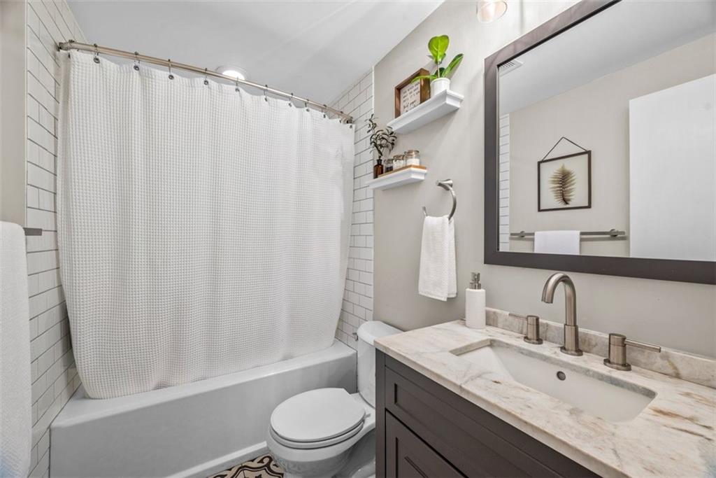 229 Lakeside Drive McKees Rocks, PA 15136 - Photo 24 of 35 a bathroom with a granite countertop sink toilet and shower