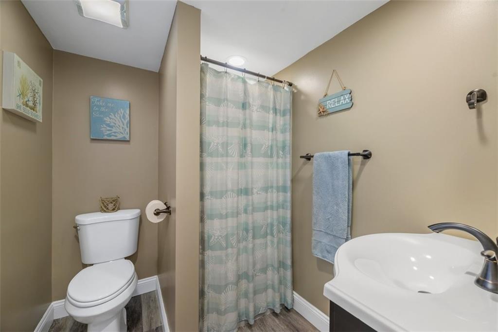 229 Lakeside Drive McKees Rocks, PA 15136 - Photo 28 of 35 a white toilet sitting next to a bathroom sink