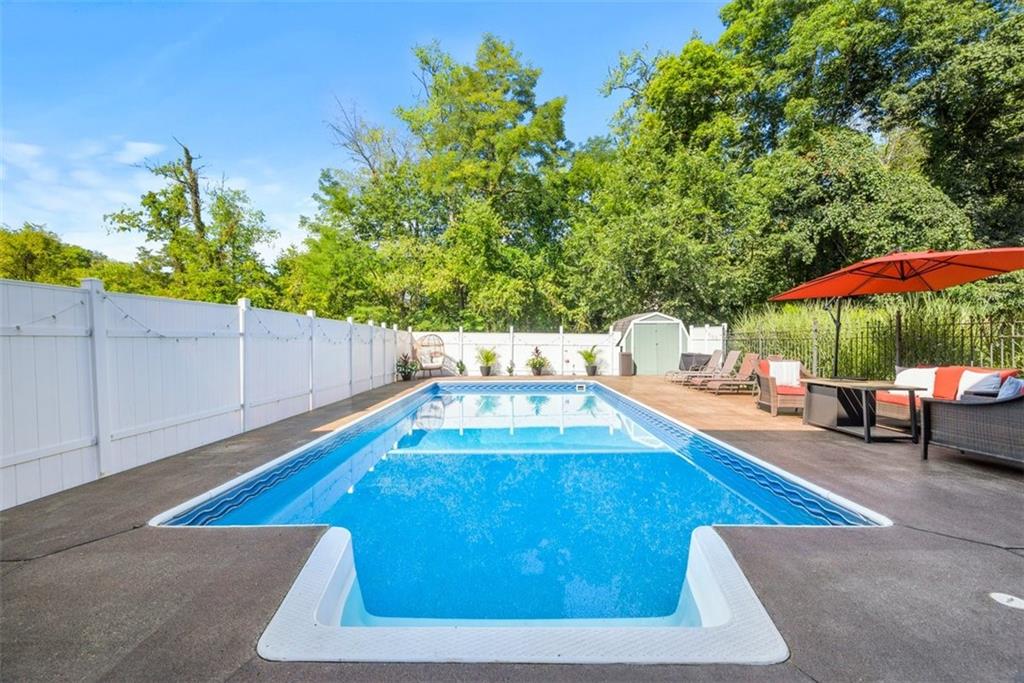 229 Lakeside Drive McKees Rocks, PA 15136 - Photo 30 of 35 a view of a swimming pool with a patio