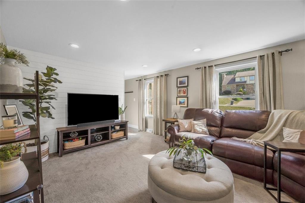 229 Lakeside Drive McKees Rocks, PA 15136 - Photo 3 of 35 a living room with furniture and a flat screen tv