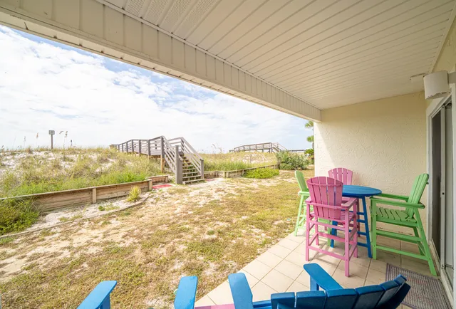 a view of an apartment with a table and chairs