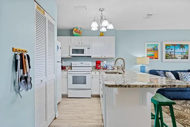 a open kitchen with stainless steel appliances granite countertop a stove and cabinets