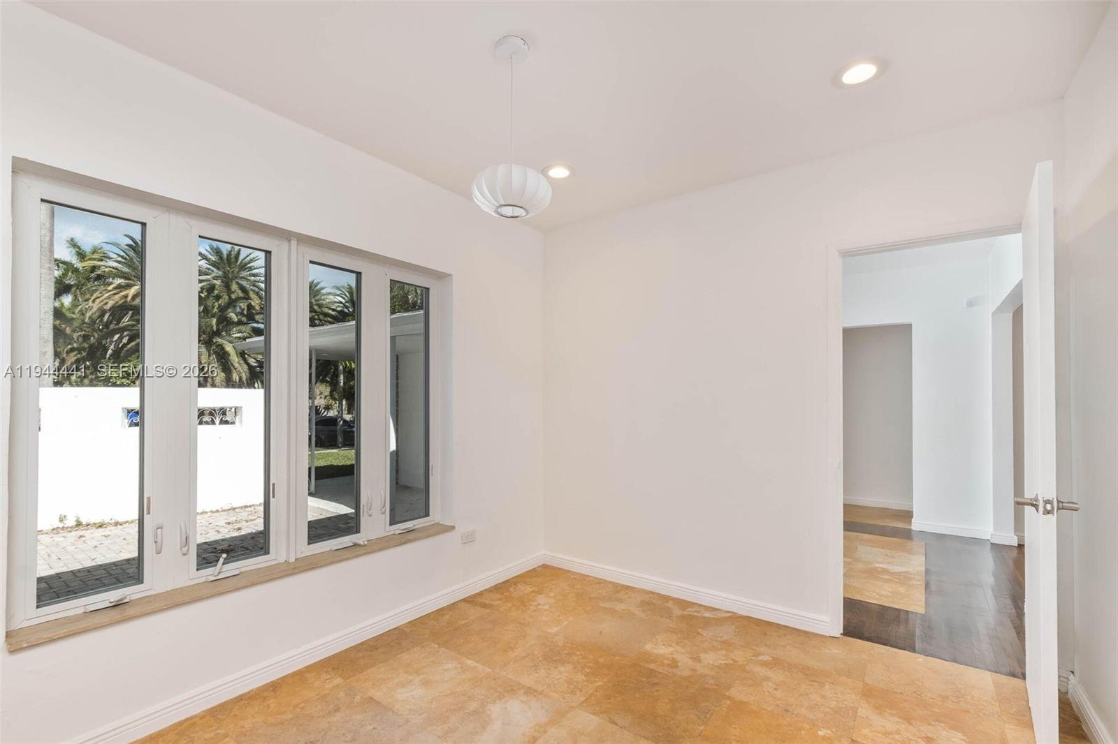 680 Northeast 57th Street Miami, FL 33137 - Photo 23 of 42 a view of an empty room with a window