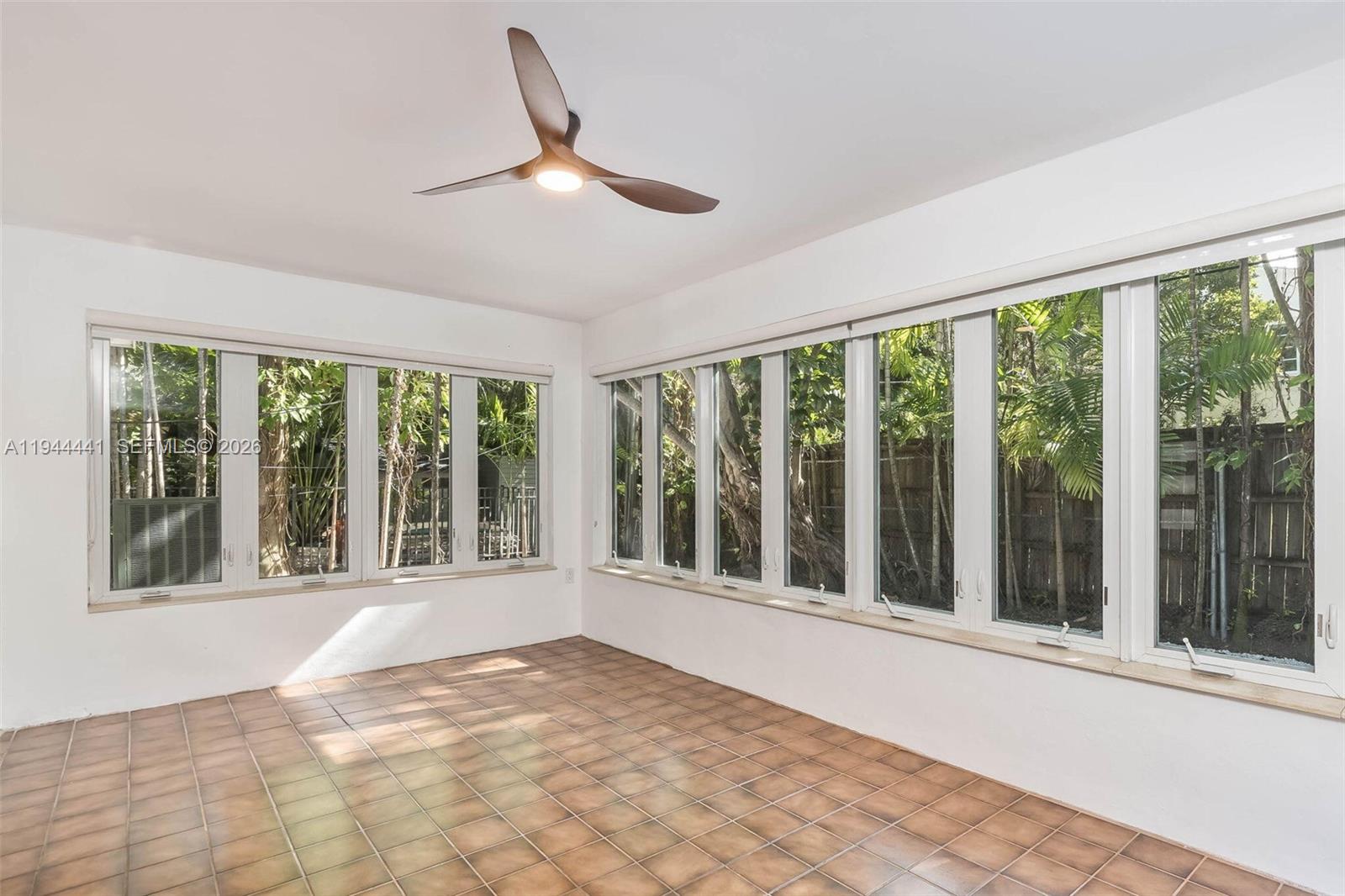 680 Northeast 57th Street Miami, FL 33137 - Photo 28 of 42 a view of an empty room with a window