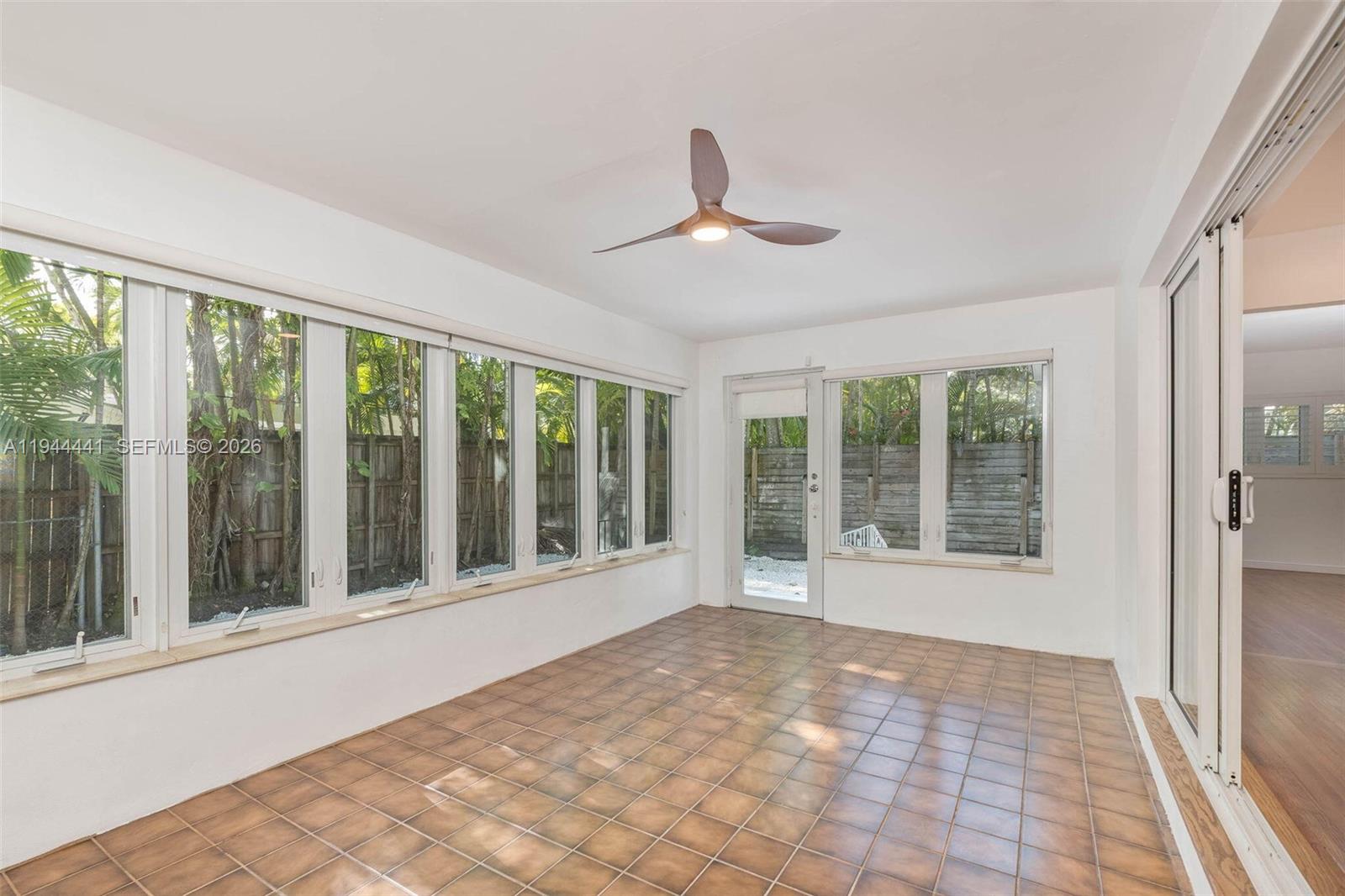680 Northeast 57th Street Miami, FL 33137 - Photo 29 of 42 a view of an empty room with a window