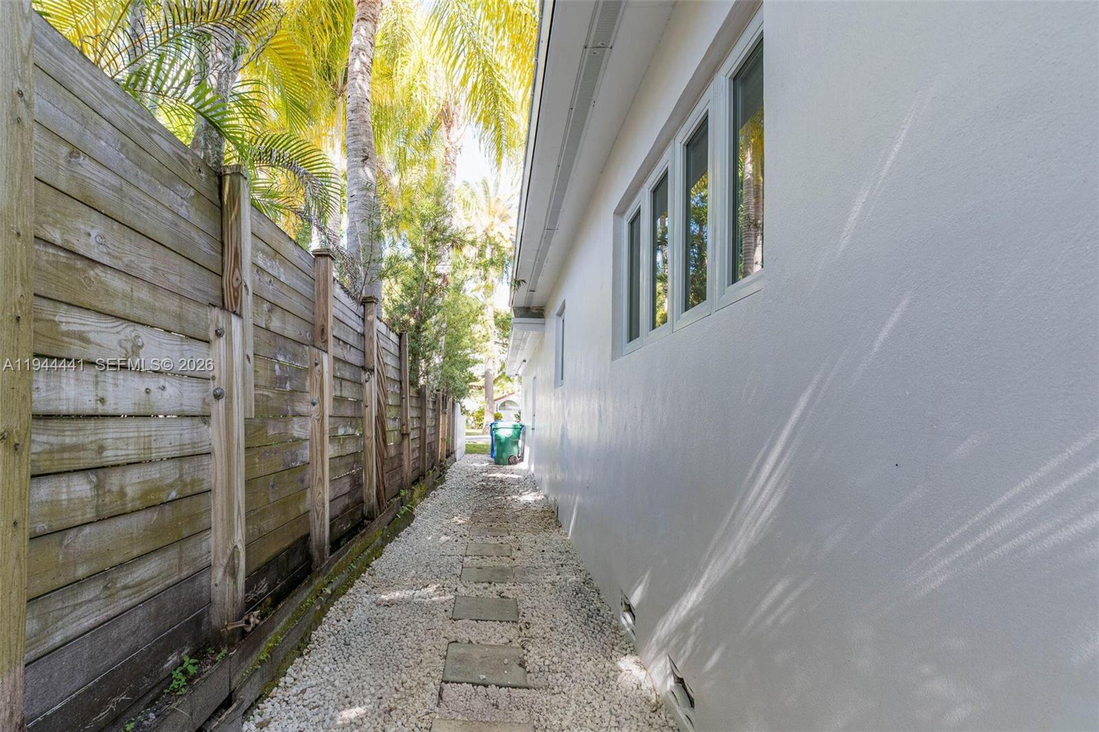 680 Northeast 57th Street Miami, FL 33137 - Photo 31 of 42 a view of a pathway of a house with a small yard