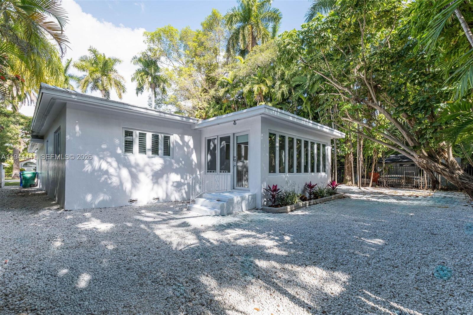 680 Northeast 57th Street Miami, FL 33137 - Photo 33 of 42 a view of a house with a yard