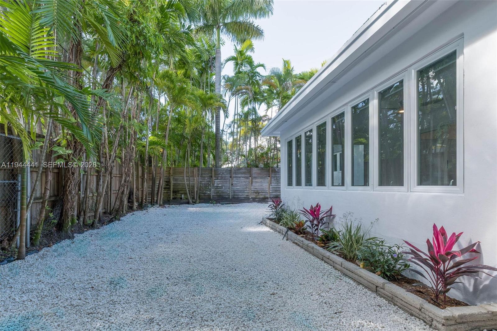 680 Northeast 57th Street Miami, FL 33137 - Photo 35 of 42 a view of a house with wooden fence