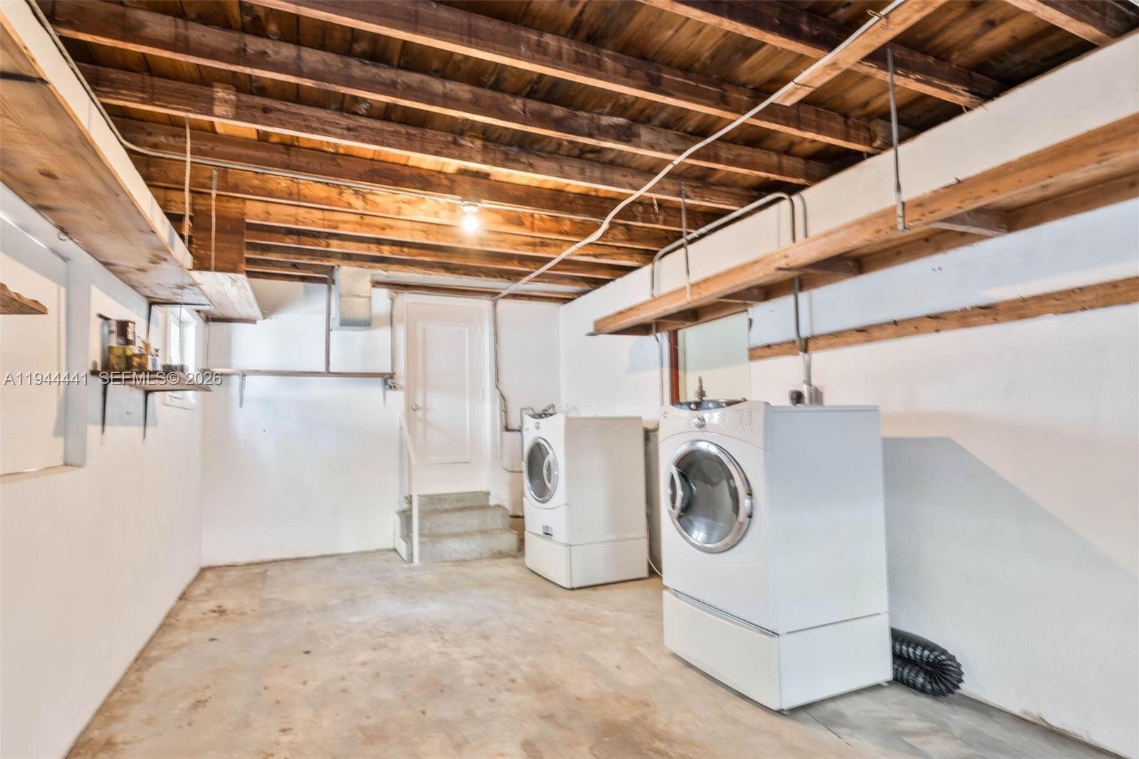 680 Northeast 57th Street Miami, FL 33137 - Photo 36 of 42 a utility room with dryer and washer