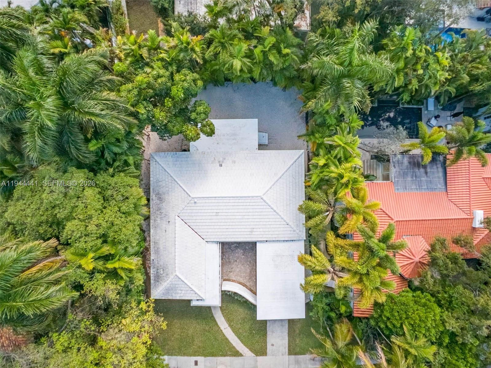 680 Northeast 57th Street Miami, FL 33137 - Photo 41 of 42 an aerial view of a house with a yard and garden