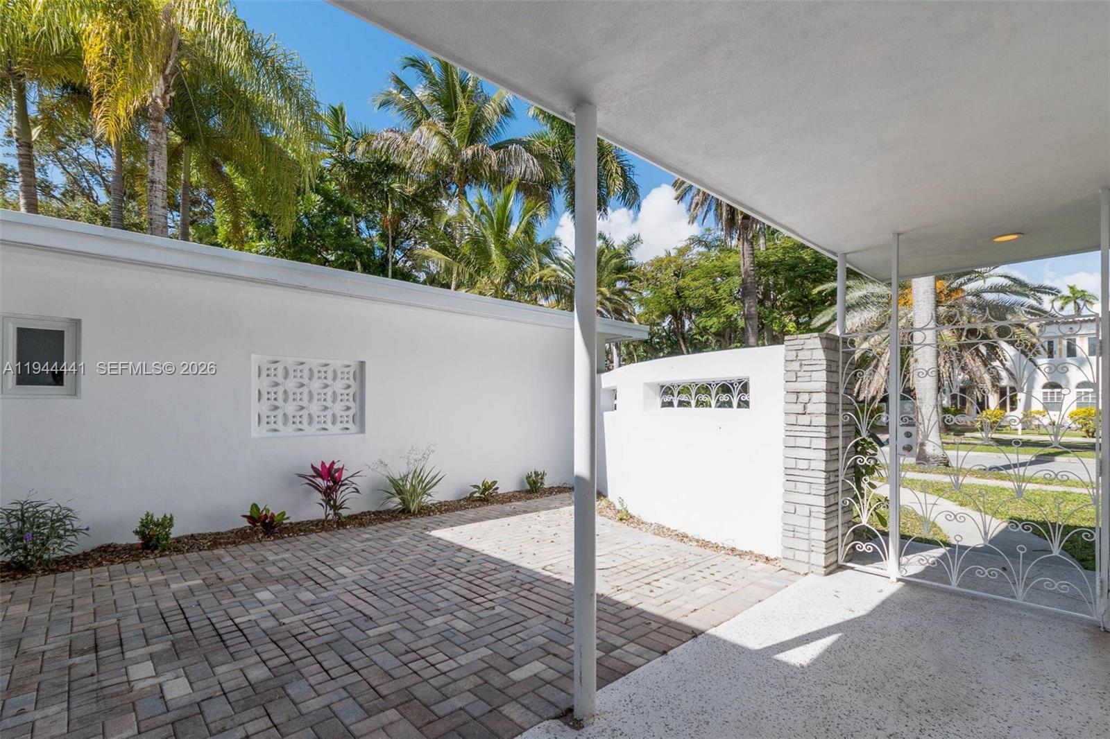 680 Northeast 57th Street Miami, FL 33137 - Photo 7 of 42 a view of a bench in the backyard
