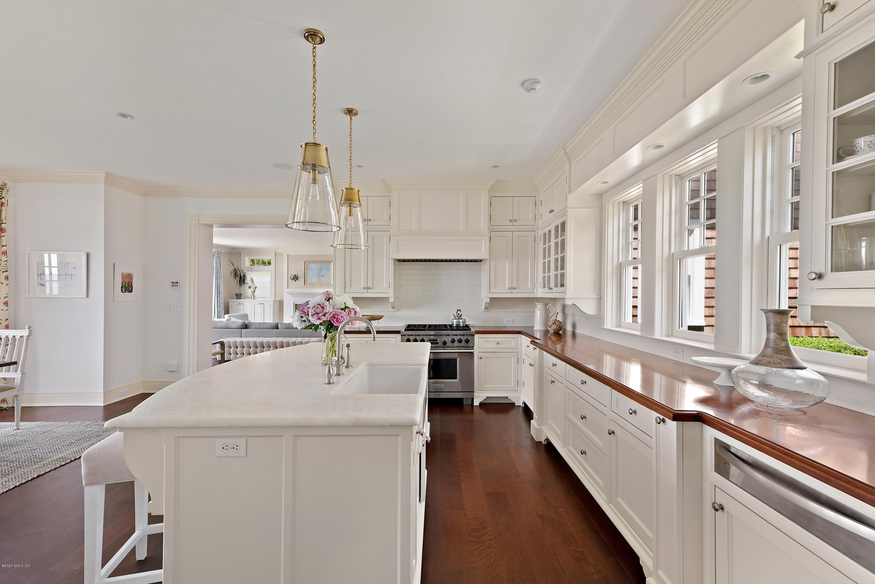 224 Long Neck Point Road Darien, CT 06820 - Photo 13 of 33 a kitchen with stainless steel appliances a sink stove and cabinets