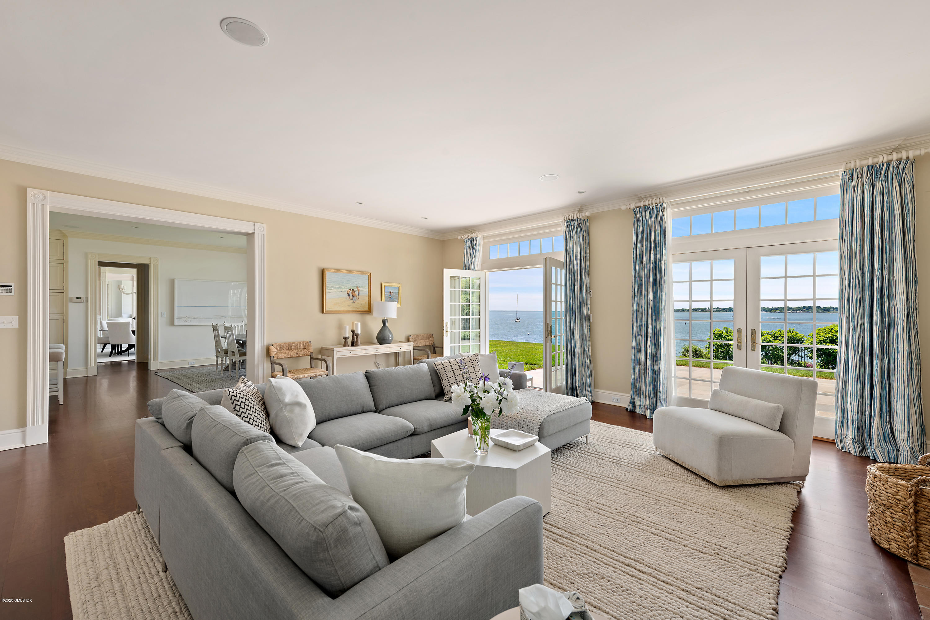 224 Long Neck Point Road Darien, CT 06820 - Photo 16 of 33 a living room with furniture and a large window