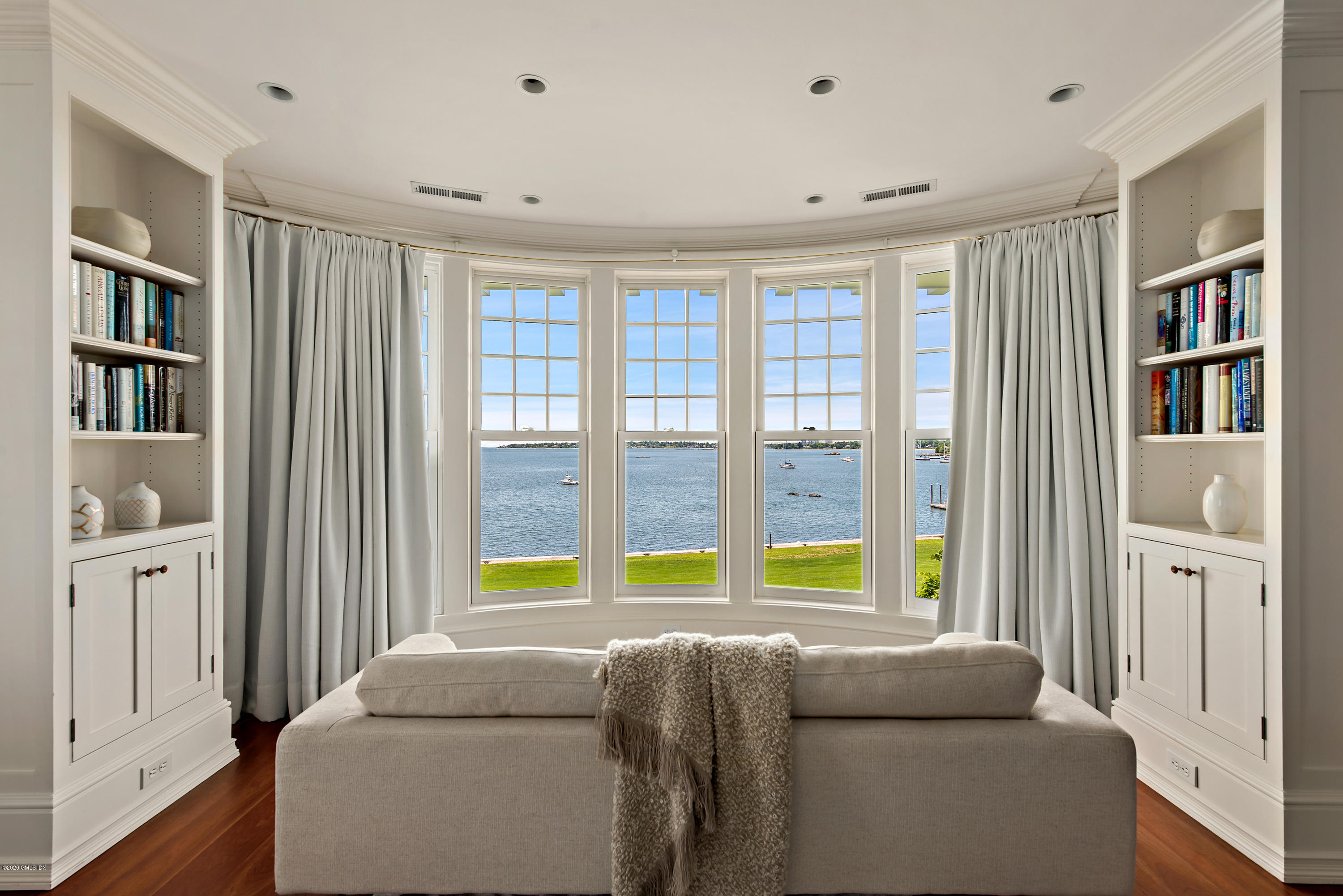 224 Long Neck Point Road Darien, CT 06820 - Photo 20 of 33 a living room with furniture and a window