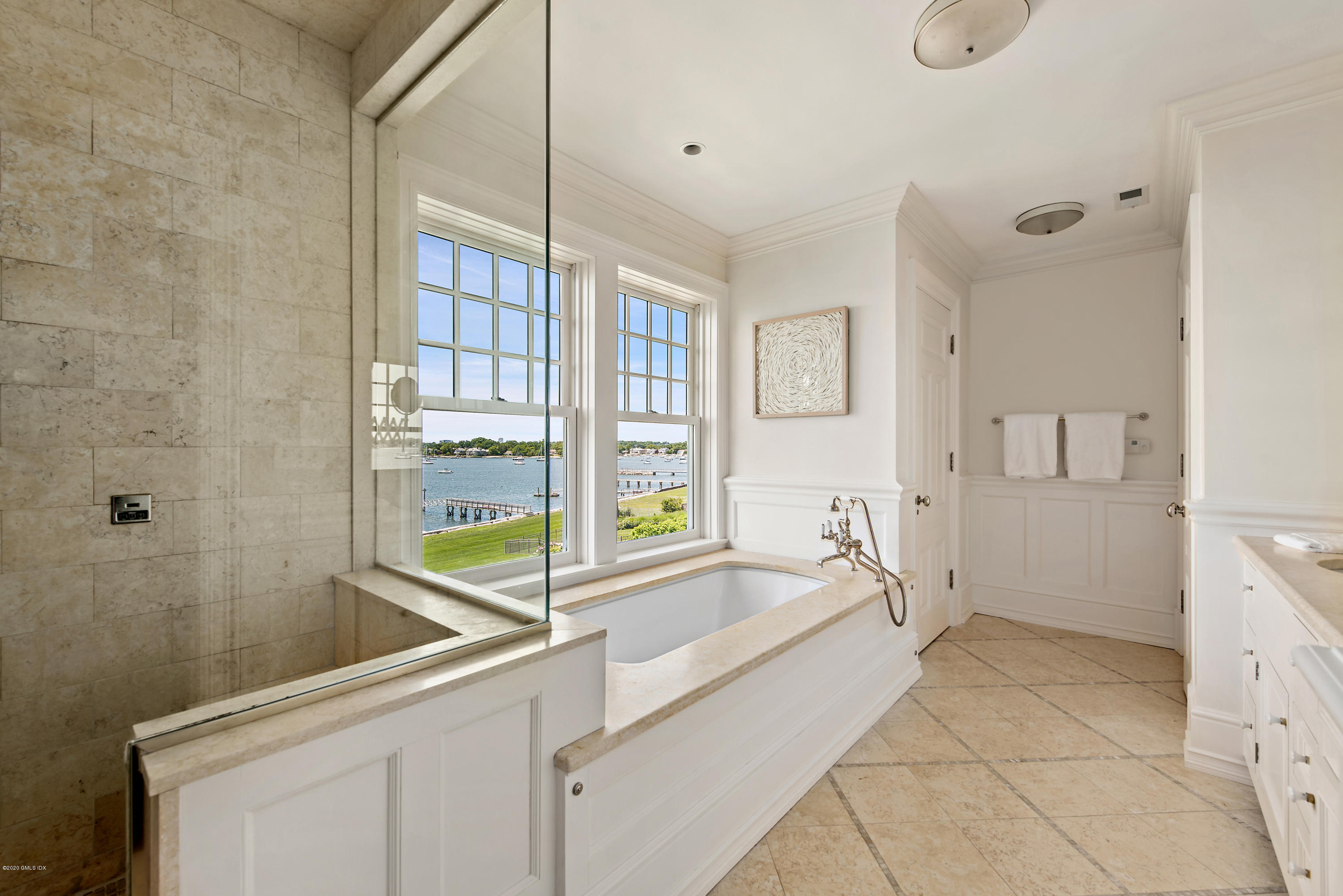 224 Long Neck Point Road Darien, CT 06820 - Photo 21 of 33 a spacious bathroom with a bathtub and a sink