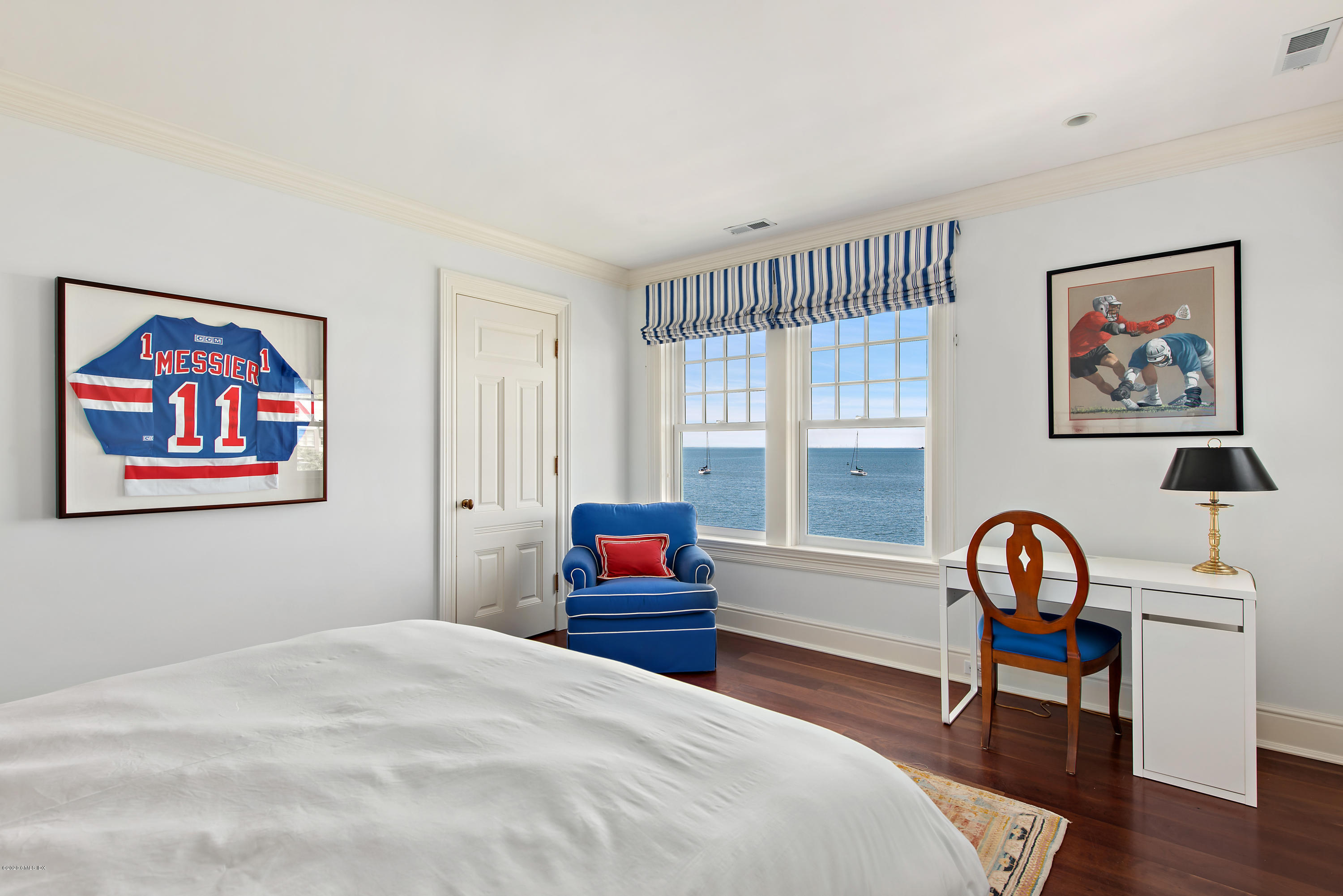224 Long Neck Point Road Darien, CT 06820 - Photo 23 of 33 a bedroom with a bed and a painting on the wall
