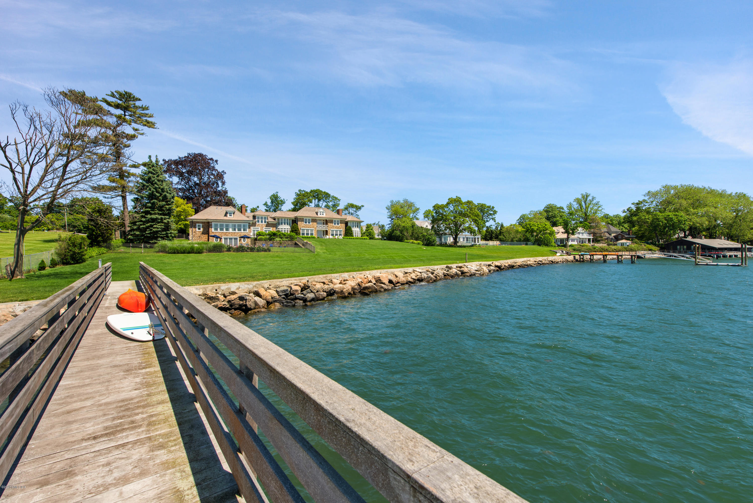 224 Long Neck Point Road Darien, CT 06820 - Photo 31 of 33 a view of a wooden deck and a yard