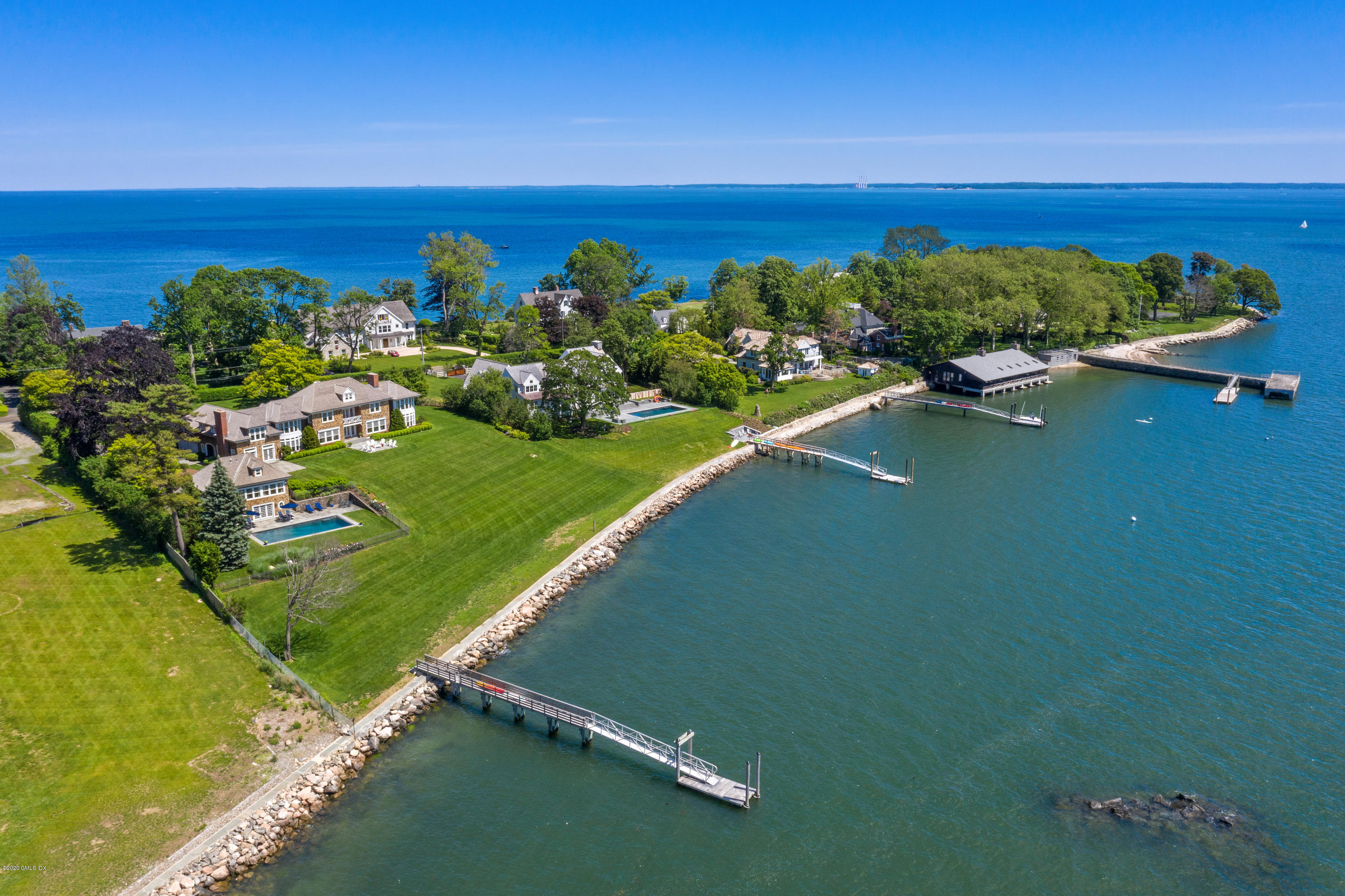 224 Long Neck Point Road Darien, CT 06820 - Photo 33 of 33 a view of a lake with a building in the background
