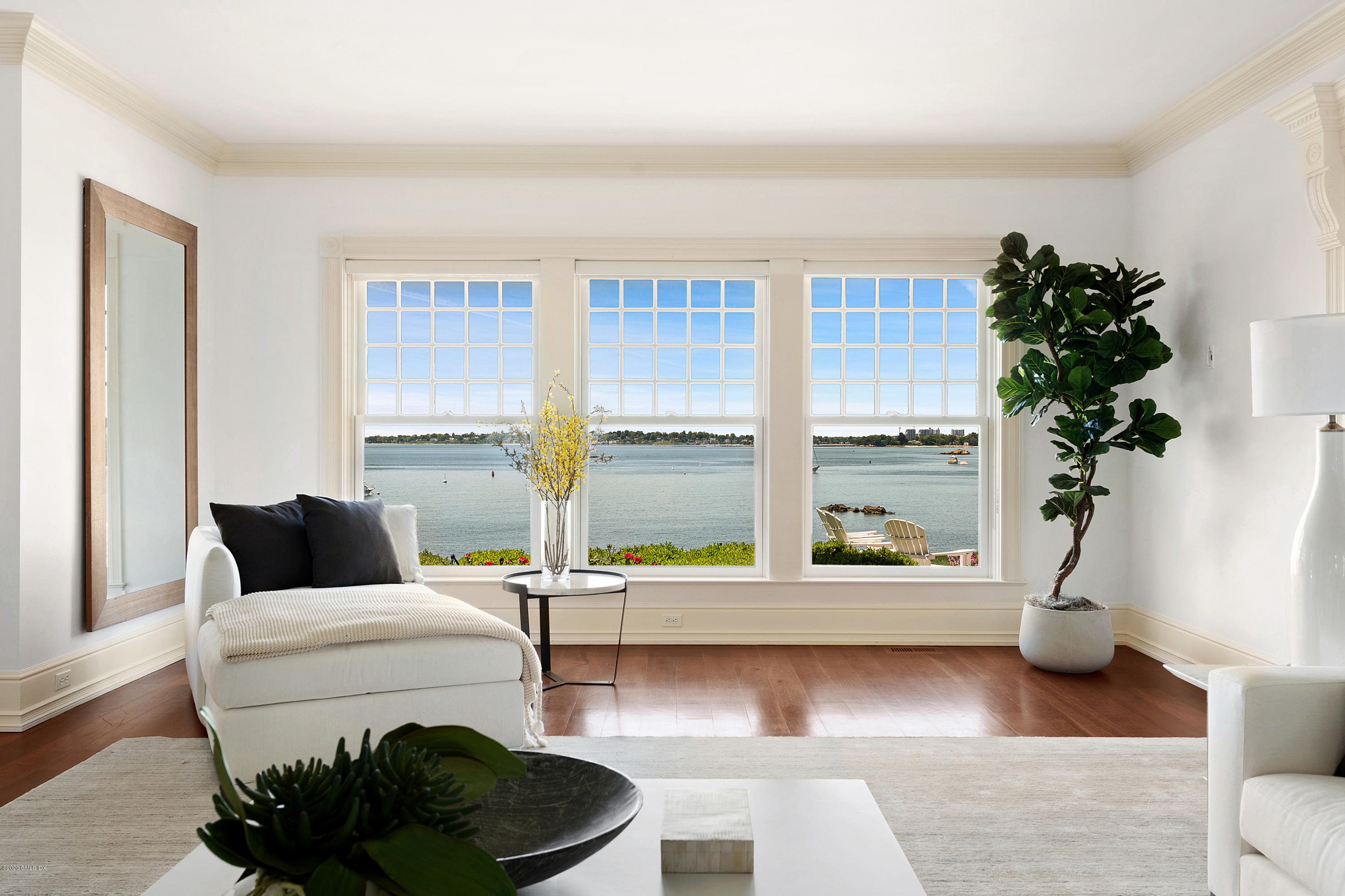 224 Long Neck Point Road Darien, CT 06820 - Photo 9 of 33 a living room with furniture and a potted plant