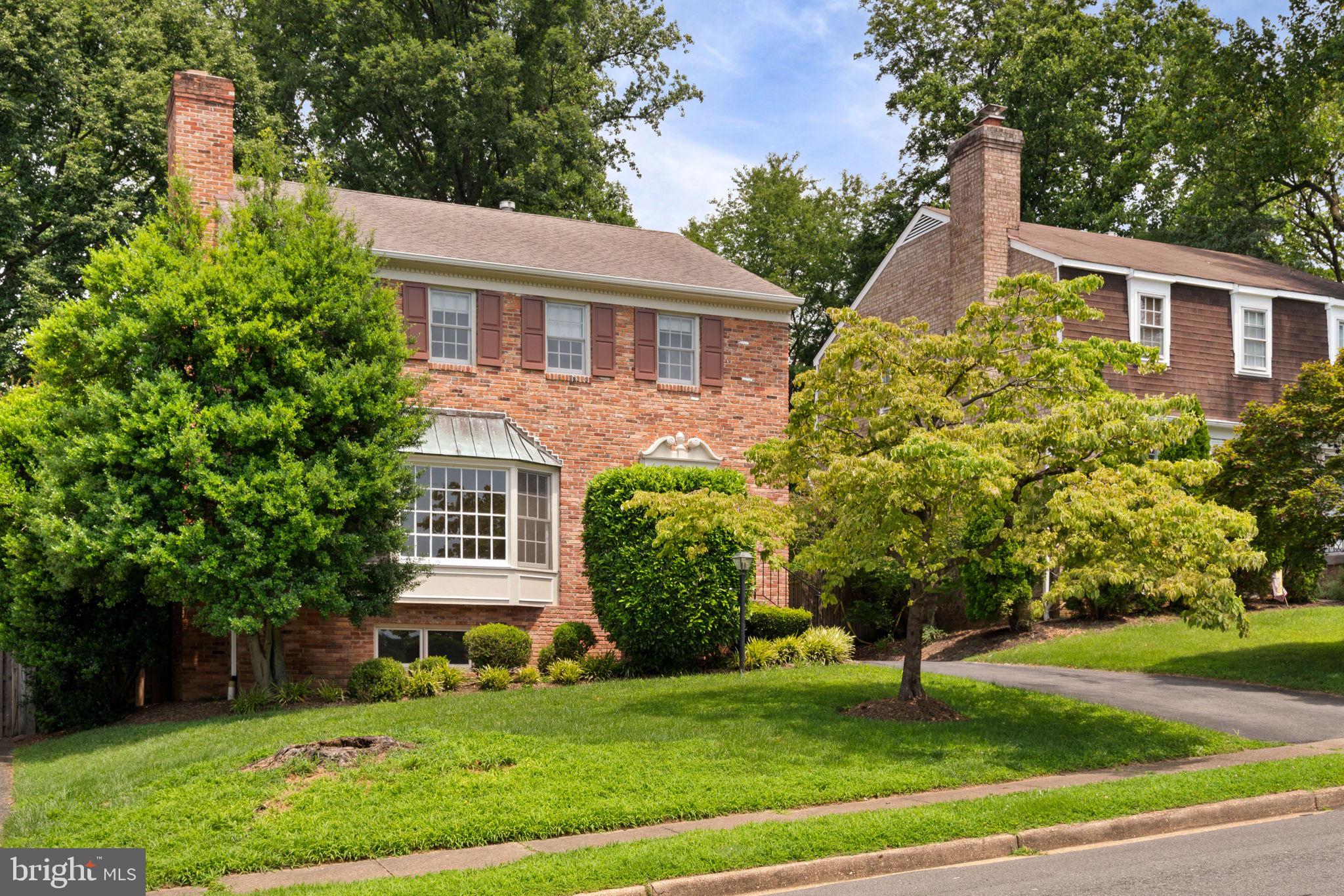 6716 Baron Road McLean, VA 22101 - Photo 1 of 41 a front view of a house with a yard