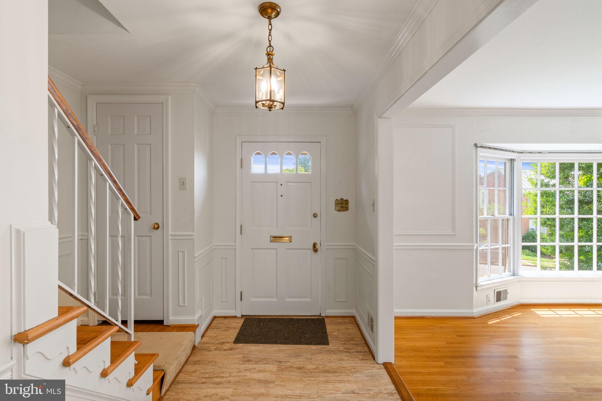 6716 Baron Road McLean, VA 22101 - Photo 11 of 41 a view of a livingroom with wooden floor and a ceiling fan