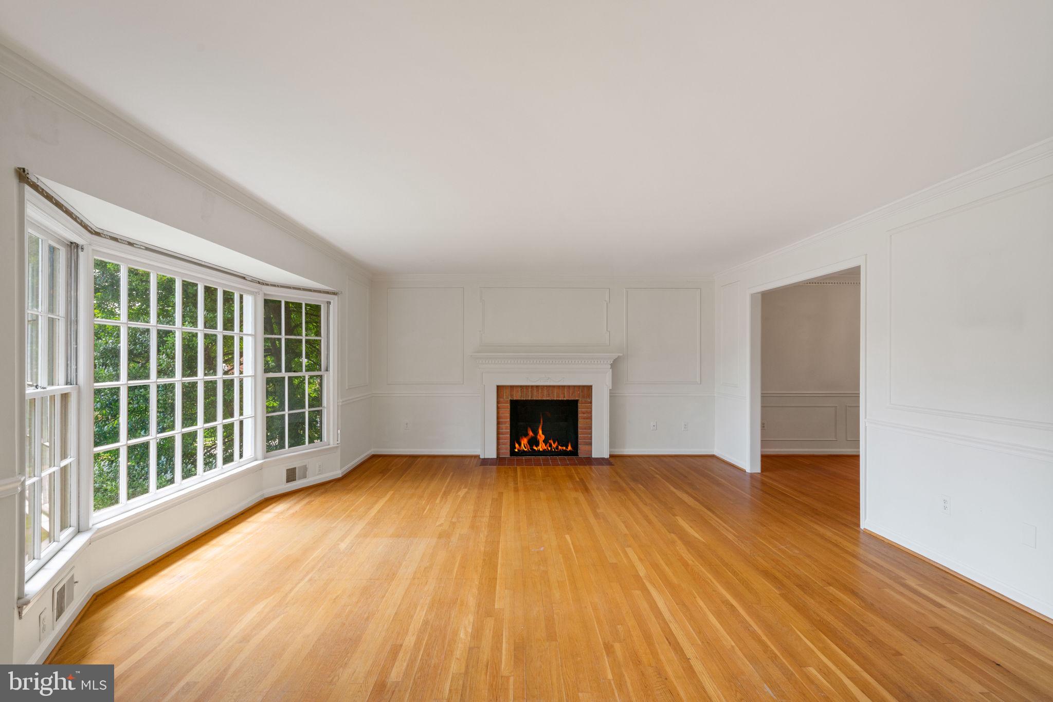 6716 Baron Road McLean, VA 22101 - Photo 12 of 41 a view of an empty room with a window and wooden floor