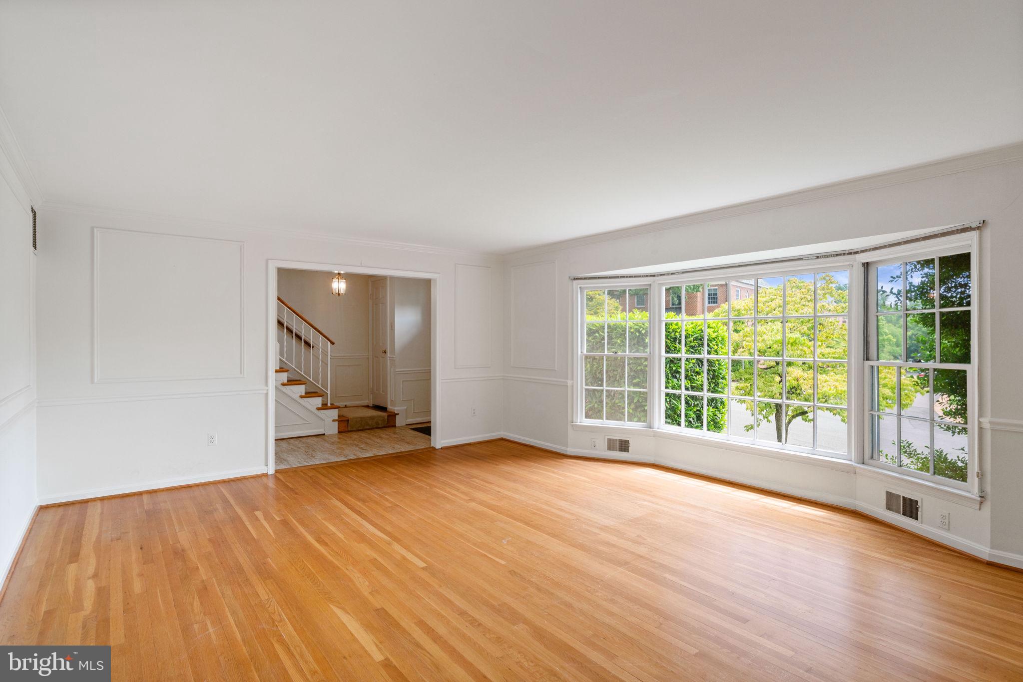 6716 Baron Road McLean, VA 22101 - Photo 13 of 41 a view of an empty room with wooden floor and a window