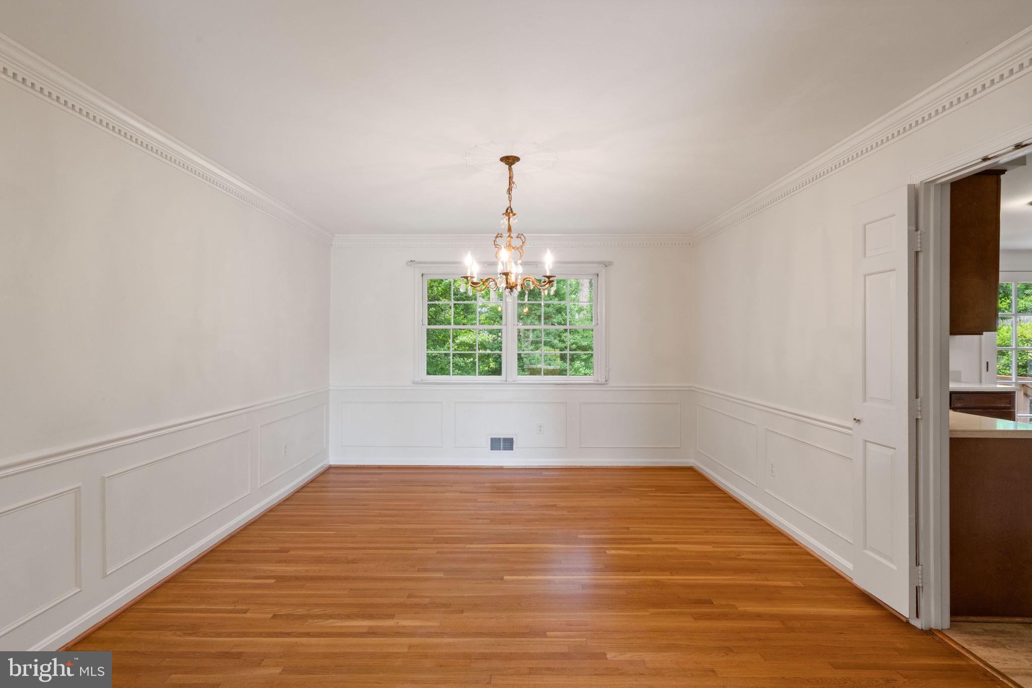 6716 Baron Road McLean, VA 22101 - Photo 15 of 41 a view of an empty room with wooden floor and a window