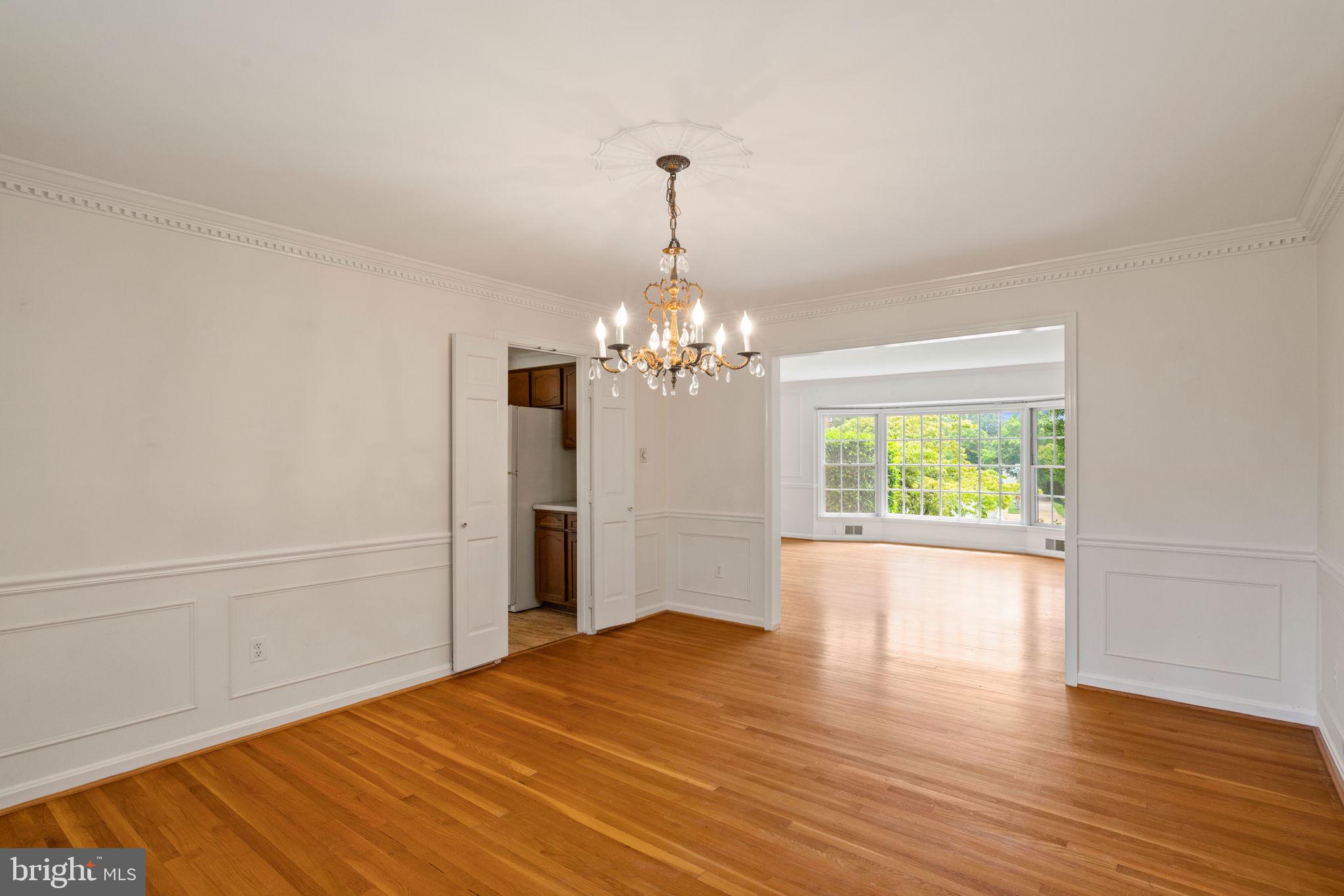 6716 Baron Road McLean, VA 22101 - Photo 17 of 41 a view of an empty room with wooden floor and a window