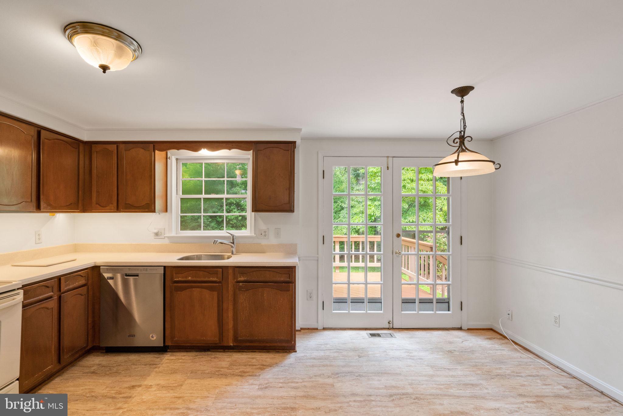 6716 Baron Road McLean, VA 22101 - Photo 19 of 41 a kitchen with a sink and window