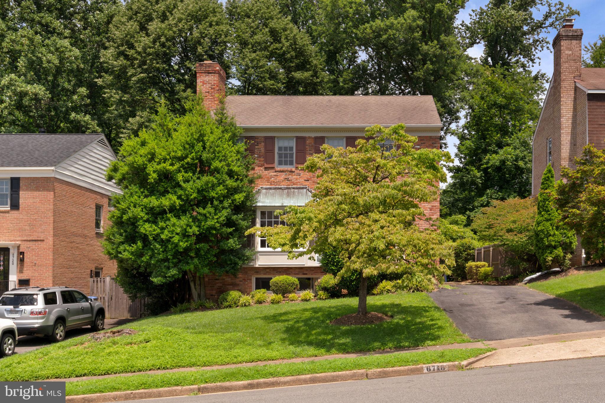 6716 Baron Road McLean, VA 22101 - Photo 2 of 41 a aerial view of a house with a yard and plants