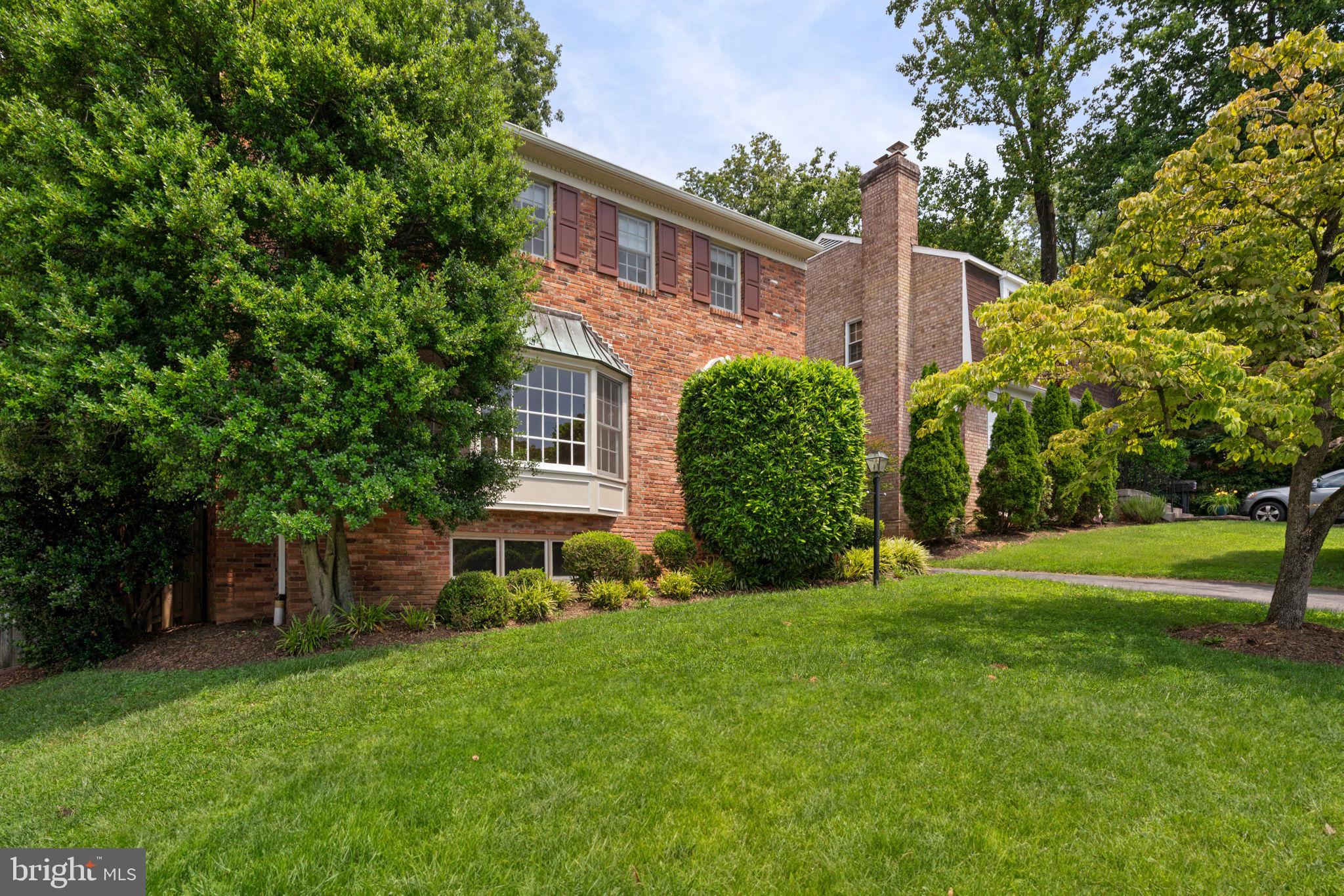 6716 Baron Road McLean, VA 22101 - Photo 3 of 41 a view of a house with a yard and plants