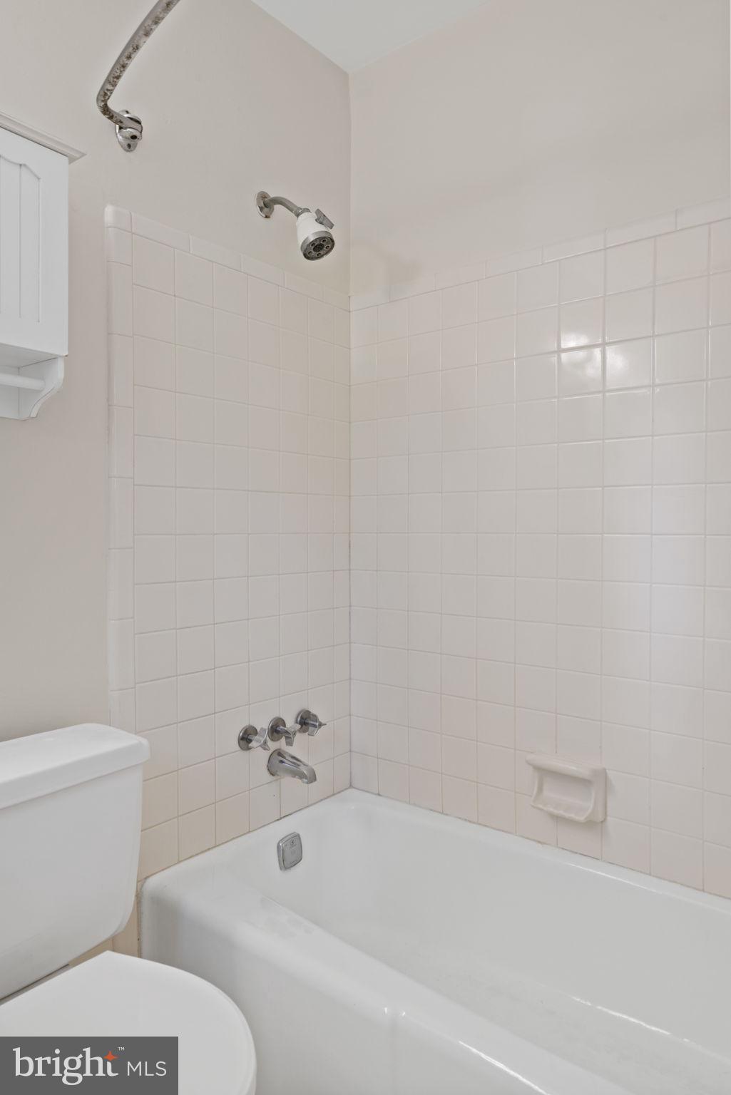 6716 Baron Road McLean, VA 22101 - Photo 32 of 41 a bathroom with a bathtub and a toilet