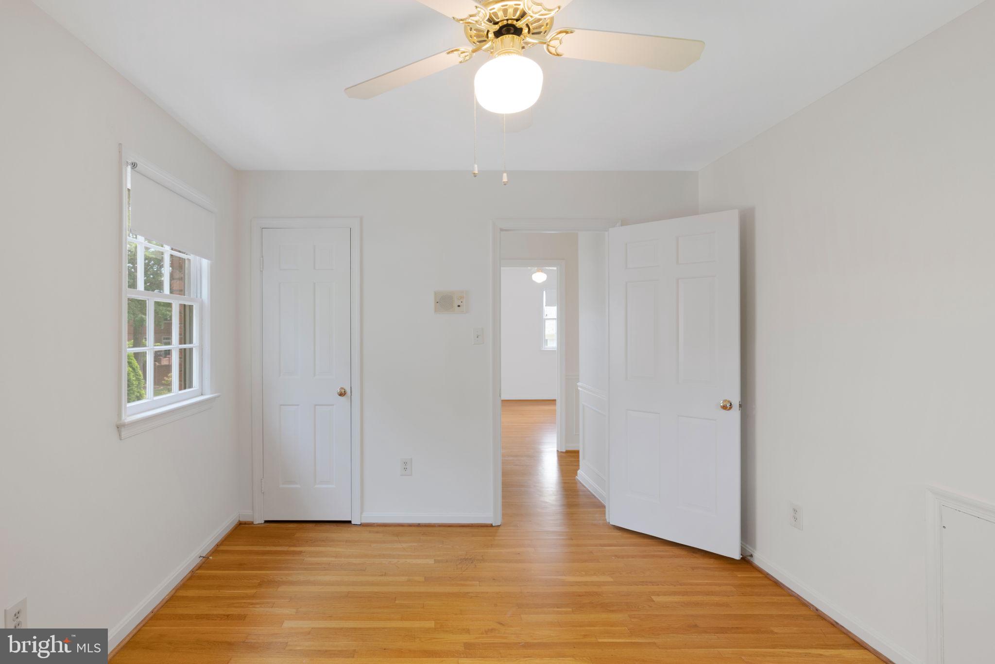 6716 Baron Road McLean, VA 22101 - Photo 33 of 41 a view of an empty room with a window and wooden floor