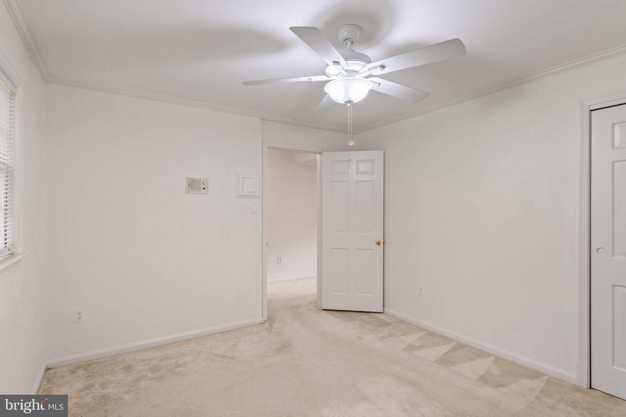6716 Baron Road McLean, VA 22101 - Photo 38 of 41 an empty room with a chandelier fan