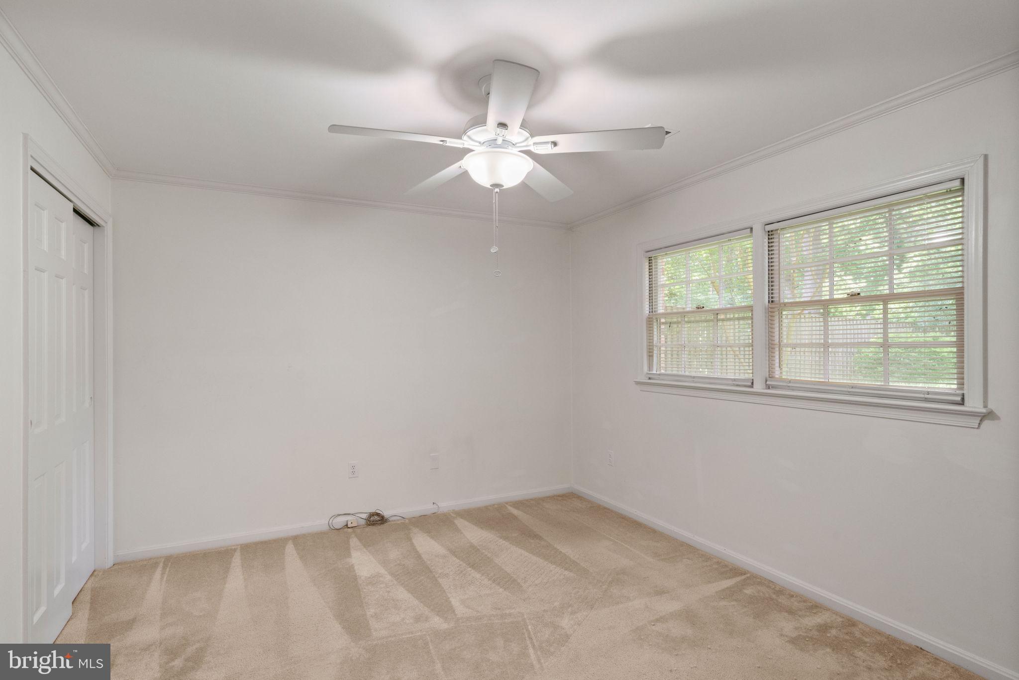 6716 Baron Road McLean, VA 22101 - Photo 39 of 41 an empty room with a window and a fan