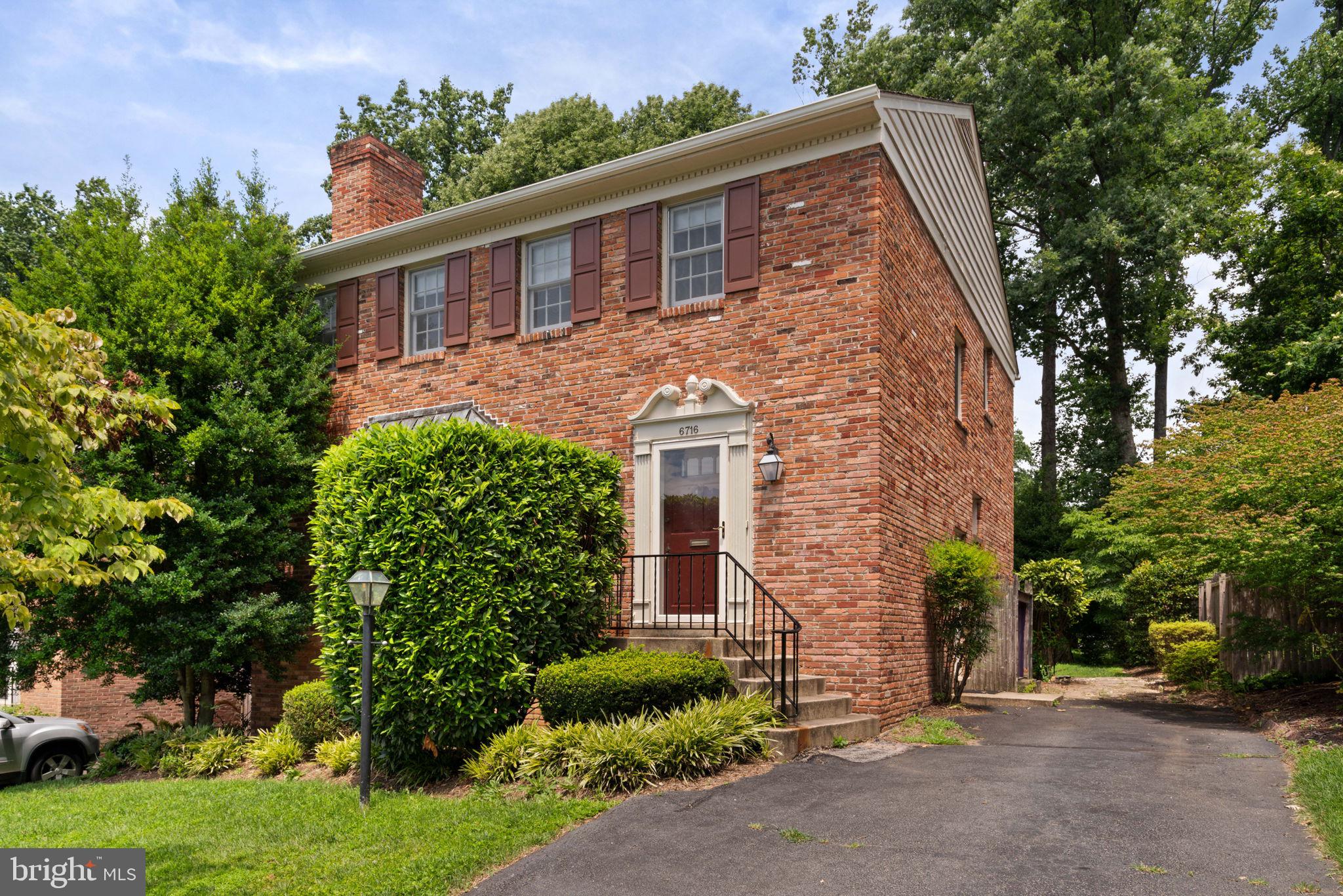6716 Baron Road McLean, VA 22101 - Photo 4 of 41 a front view of a house with a yard