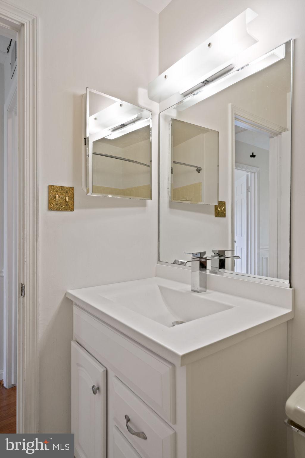 6716 Baron Road McLean, VA 22101 - Photo 41 of 41 a bathroom with a sink and a mirror