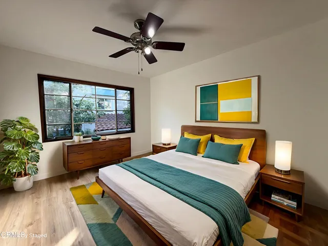 a bedroom with a bed and a couch